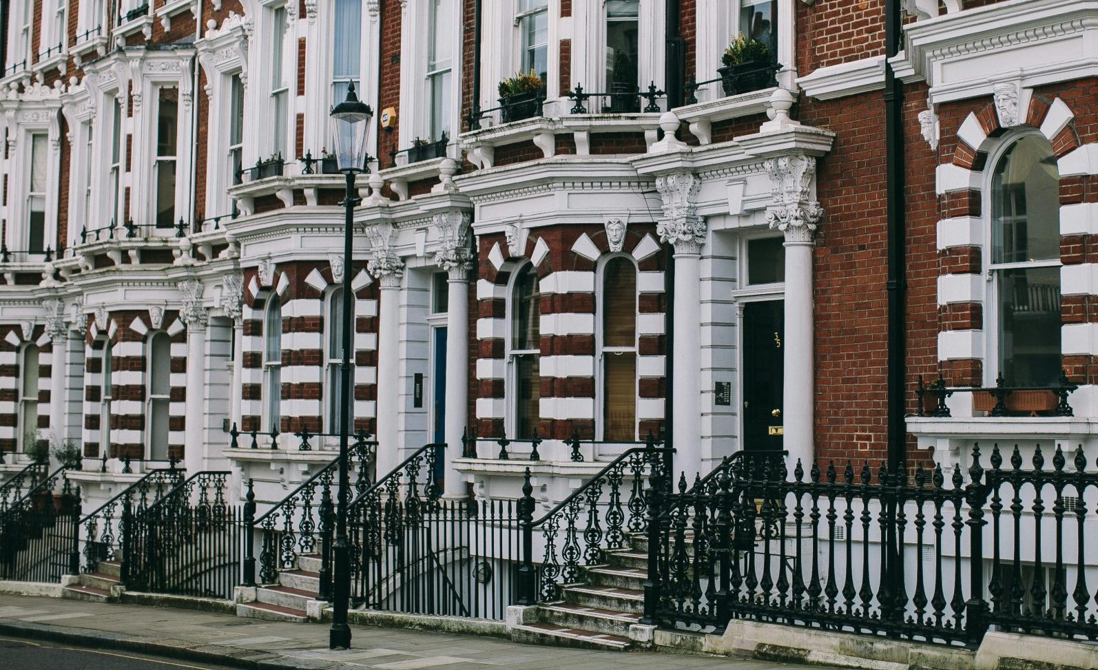 Row of classic Victorian townhouses in Hortons Street, London, showcasing architectural elegance.